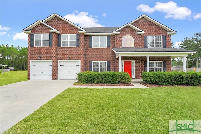 view of front of home featuring a garage, a front lawn, and covered porch