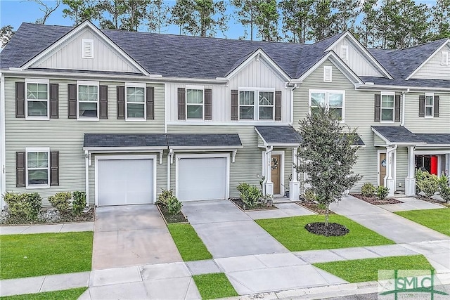 townhome / multi-family property featuring board and batten siding, driveway, a garage, and roof with shingles