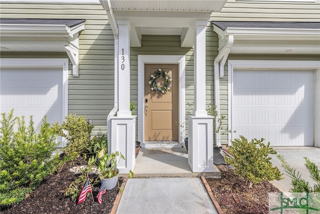 property entrance with a garage