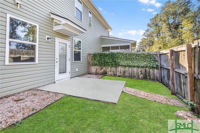 view of yard with a fenced backyard and a patio area