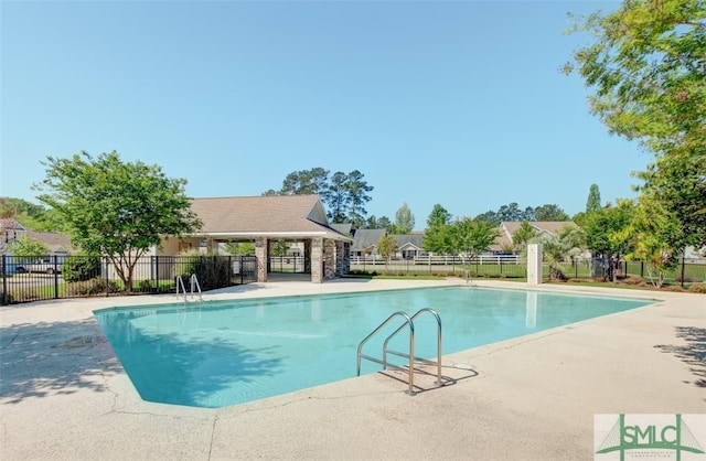 view of pool featuring a patio