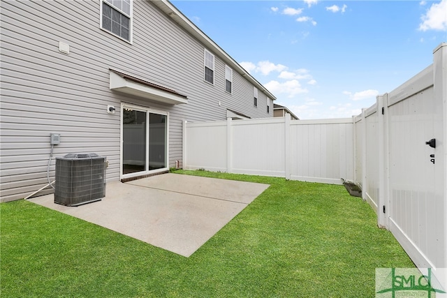 view of yard with central AC unit and a patio