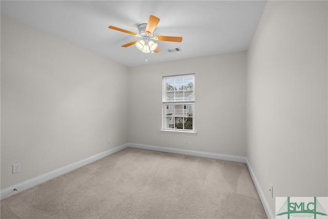 carpeted empty room with ceiling fan