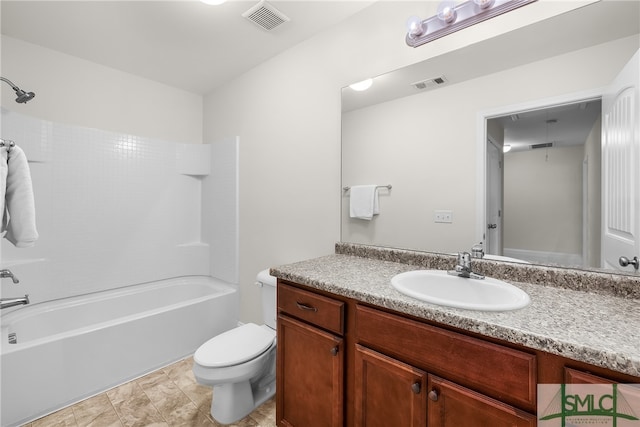 full bathroom featuring vanity, toilet, and shower / tub combination