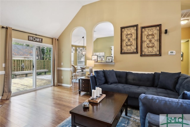 living room featuring hardwood / wood-style floors and lofted ceiling