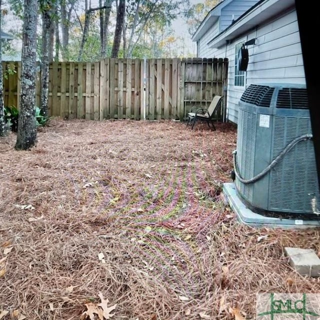 view of yard with central air condition unit