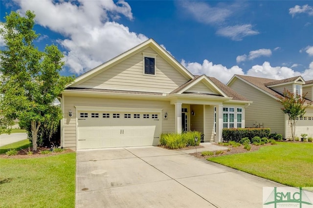 view of front of property featuring a garage, a front lawn, and concrete driveway