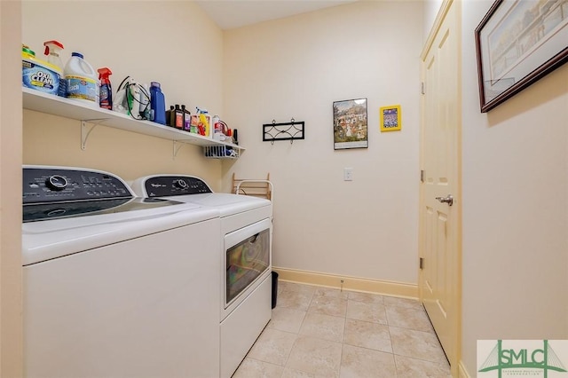 laundry area with laundry area, light tile patterned floors, baseboards, and independent washer and dryer