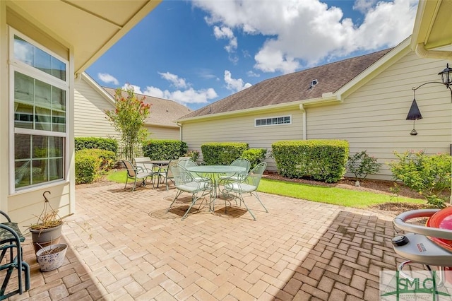 view of patio featuring outdoor dining area