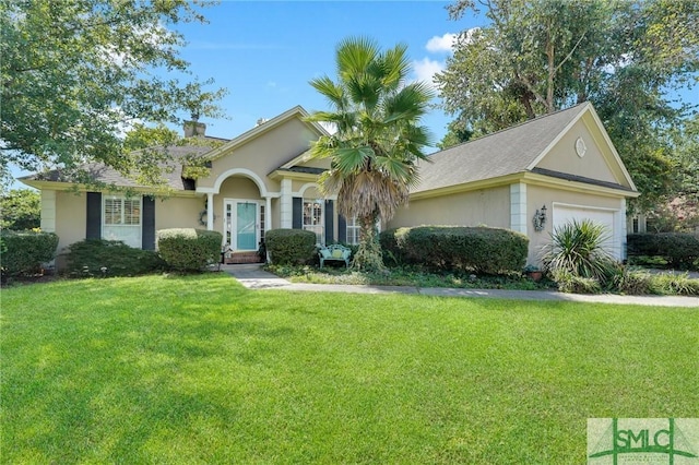 view of front facade featuring an attached garage, a front lawn, and stucco siding