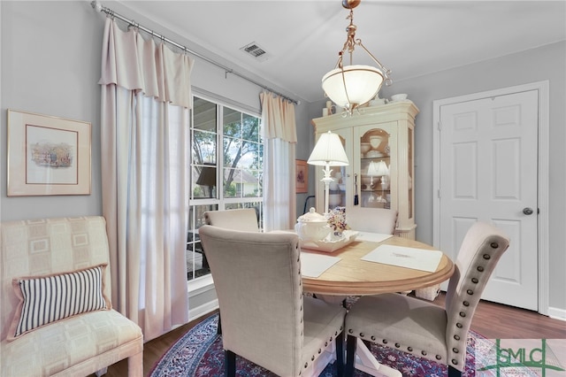 dining space featuring dark hardwood / wood-style flooring