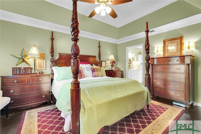 bedroom featuring dark wood-type flooring, visible vents, a ceiling fan, ornamental molding, and ensuite bath