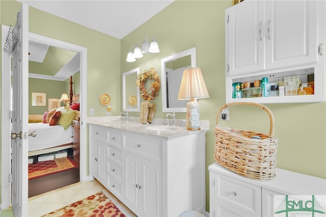 bathroom with tile patterned floors and vanity