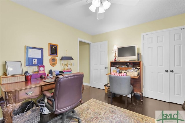 office with a ceiling fan and wood finished floors