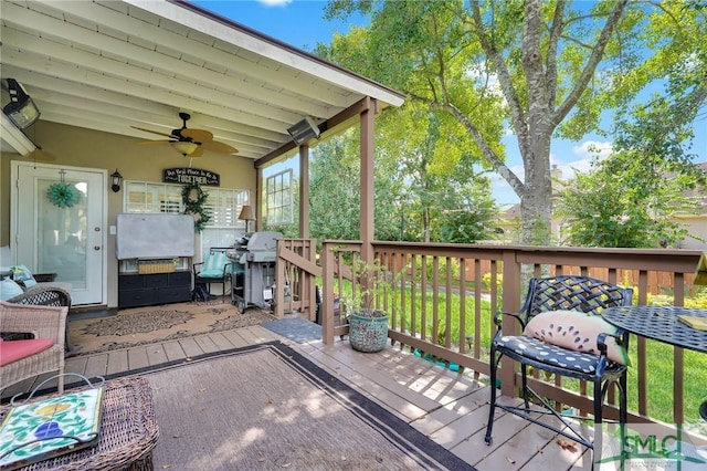 deck featuring a ceiling fan and grilling area