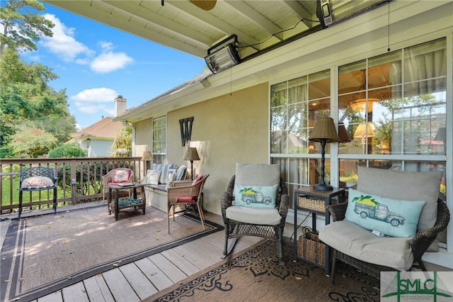 view of patio featuring outdoor lounge area and a wooden deck