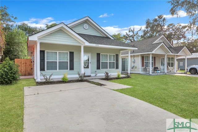 view of front facade with a front yard and a porch