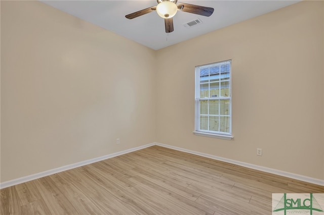 spare room featuring ceiling fan and light hardwood / wood-style floors