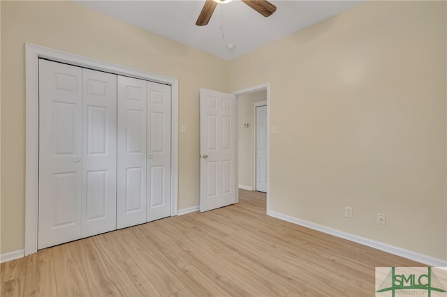 unfurnished bedroom with light wood-type flooring, a closet, and ceiling fan