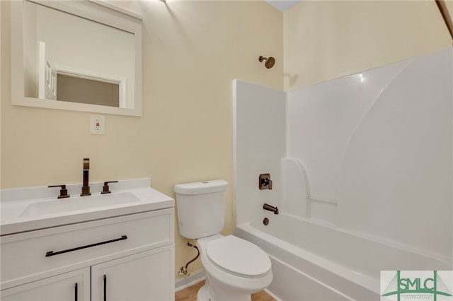 full bathroom featuring toilet, shower / bathing tub combination, and vanity