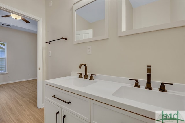 bathroom with vanity, wood-type flooring, and ceiling fan