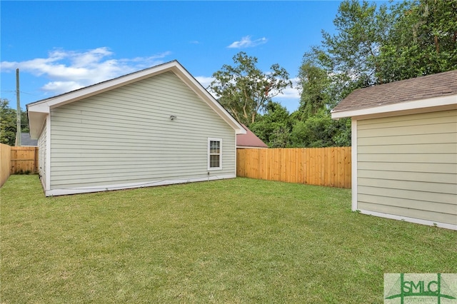 rear view of property with a lawn