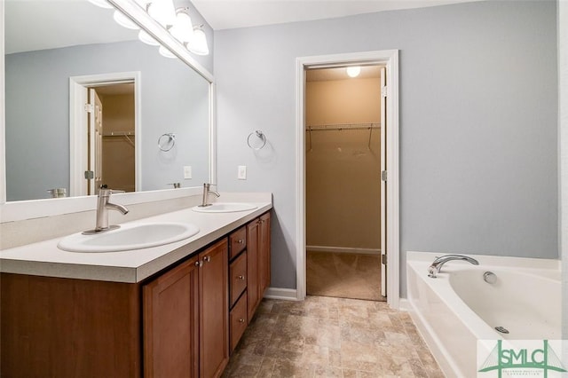 bathroom with a bathtub and vanity