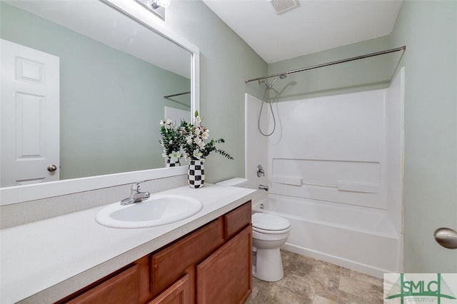 full bathroom with bathtub / shower combination, toilet, and vanity