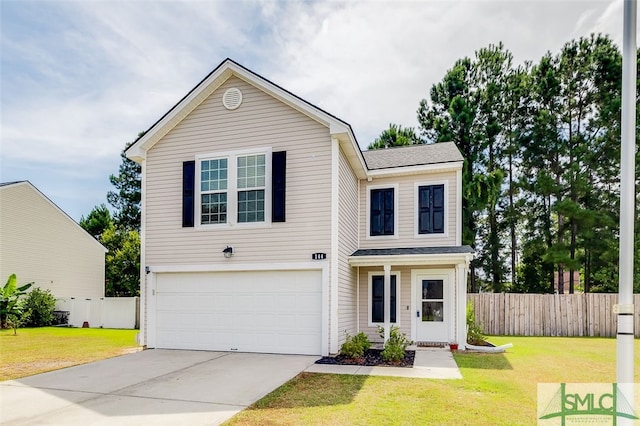 view of front of home featuring a front yard and a garage