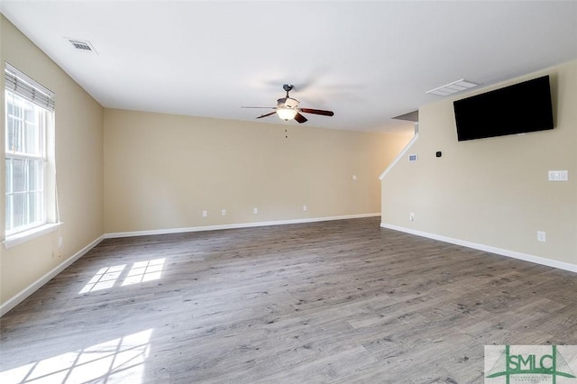 spare room featuring ceiling fan and light hardwood / wood-style flooring