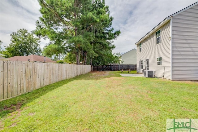 view of yard with cooling unit and a patio area