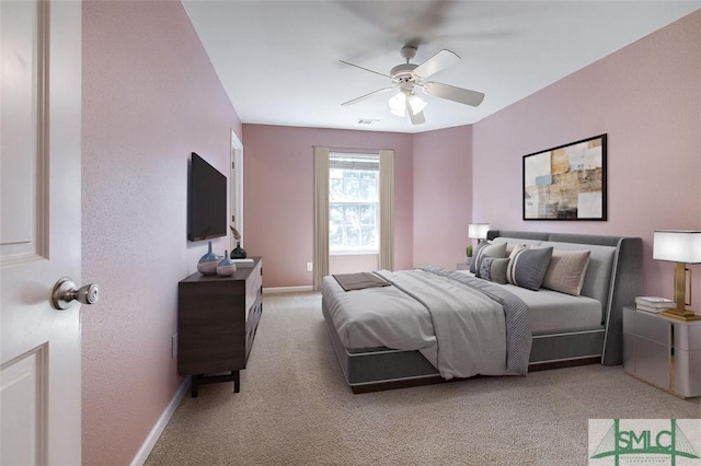 bedroom featuring ceiling fan and light colored carpet