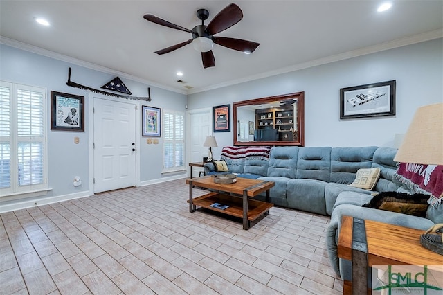 living room featuring ceiling fan, ornamental molding, and light hardwood / wood-style floors