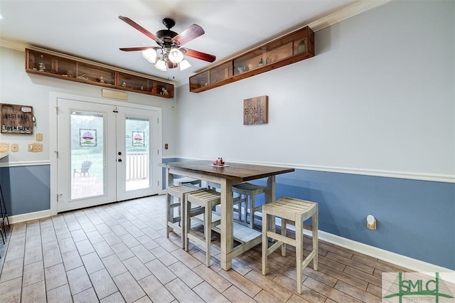 dining room with french doors, ceiling fan, light hardwood / wood-style flooring, and ornamental molding