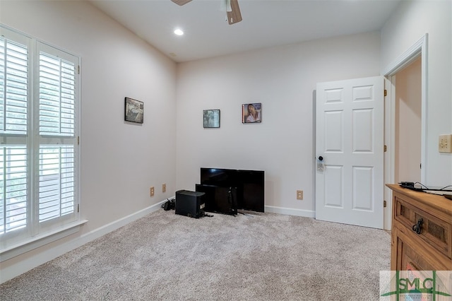 misc room featuring ceiling fan and light colored carpet