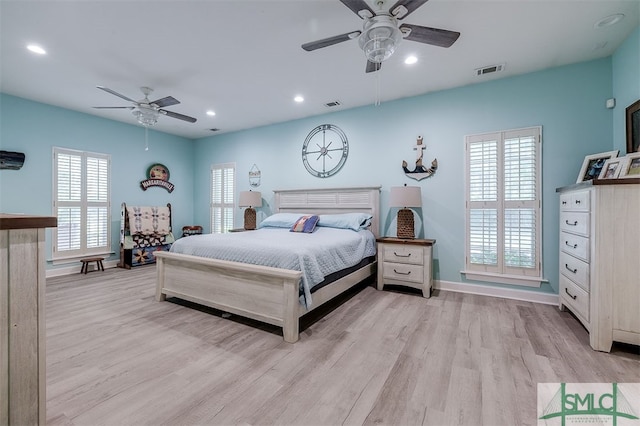 bedroom with light wood-type flooring and ceiling fan