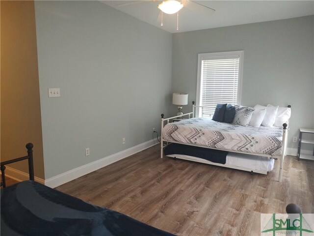 bedroom featuring ceiling fan and wood-type flooring