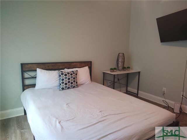 bedroom featuring wood-type flooring