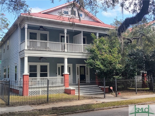 view of front of home with ceiling fan, a balcony, and a porch