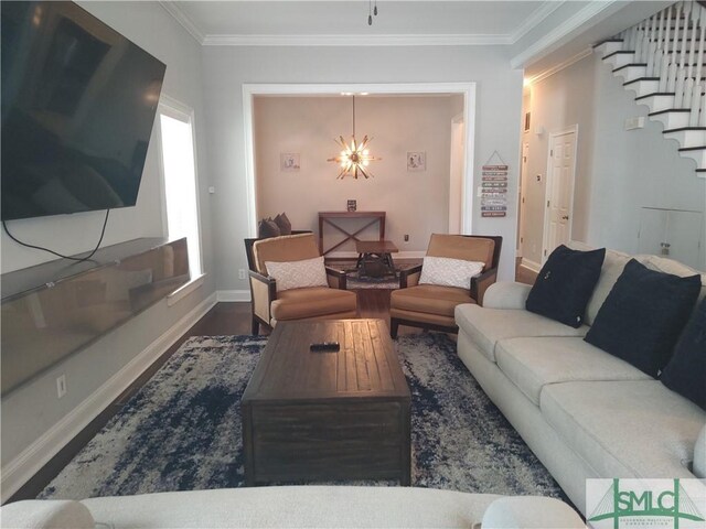 living room featuring crown molding, a chandelier, and dark hardwood / wood-style floors