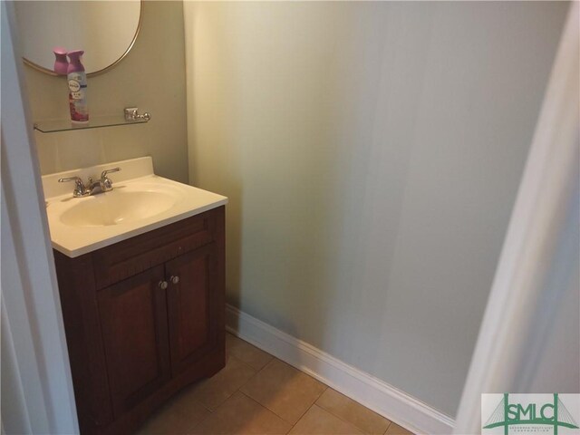 bathroom with tile patterned flooring and vanity