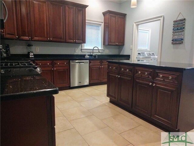 kitchen featuring dishwasher, light tile patterned floors, gas cooktop, and sink