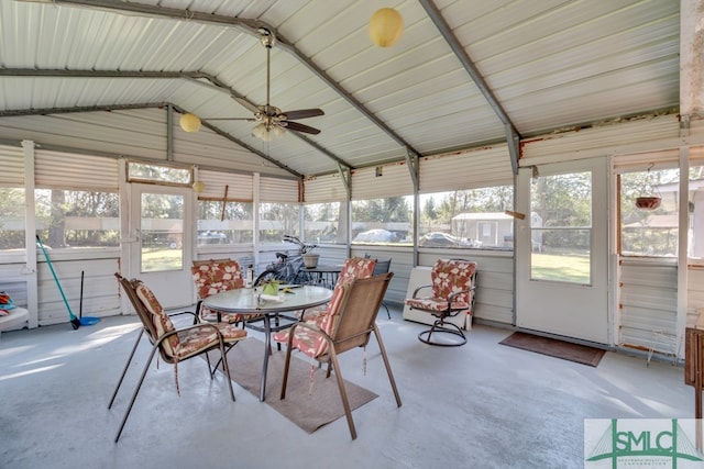 sunroom / solarium with lofted ceiling and ceiling fan