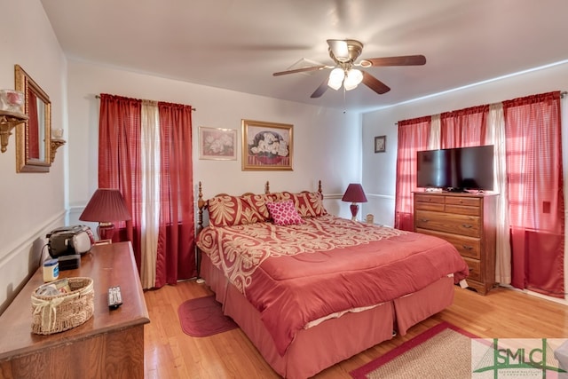 bedroom featuring light hardwood / wood-style floors and ceiling fan