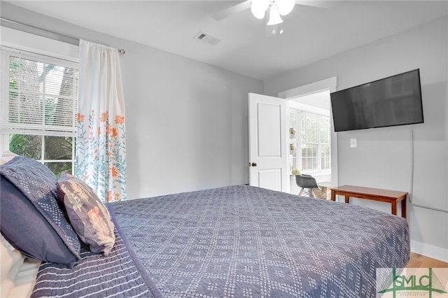 bedroom featuring ceiling fan and light hardwood / wood-style flooring