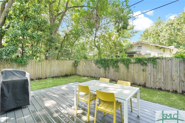 wooden terrace featuring grilling area