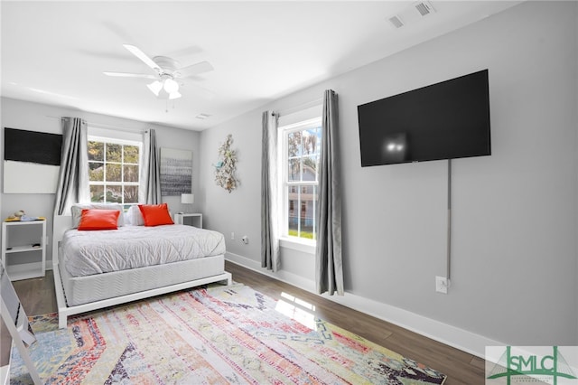 bedroom featuring hardwood / wood-style floors and ceiling fan