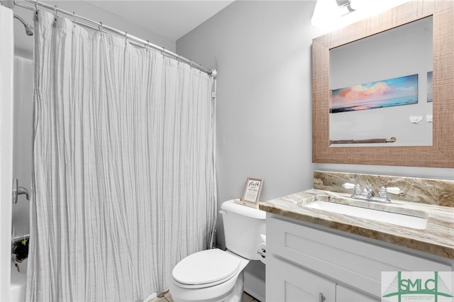 bathroom featuring vanity, toilet, and a shower with shower curtain