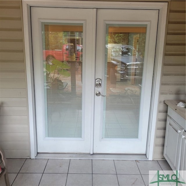 exterior space featuring french doors, a wealth of natural light, and light tile patterned flooring