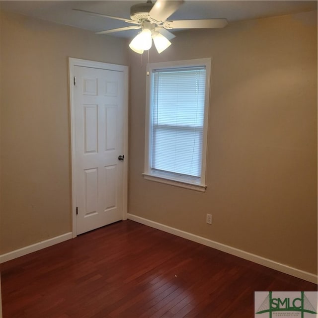 unfurnished room featuring ceiling fan and dark hardwood / wood-style floors